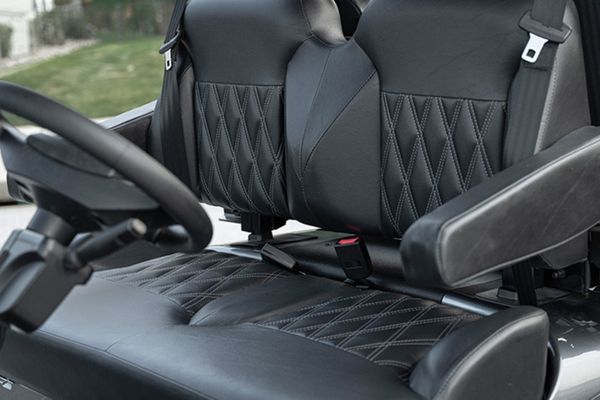 Close-up of CoolTouch upholstery with blue LED cupholder glowing at dusk